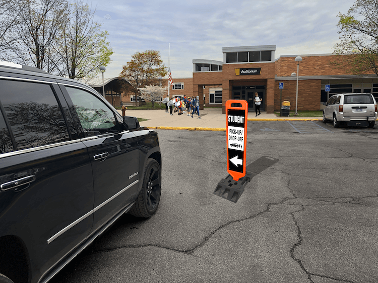 Portable Signs to Direct School Parking Lot Traffic