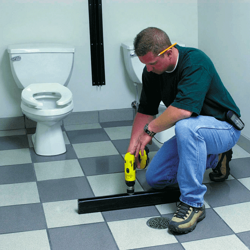 Secure the Toilet Partition Pilaster Shoes to the Floor Secure the Pilaster Shoes to the Floor