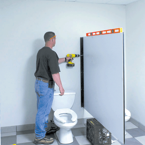 Secure the Toilet Partition Panel to the Wall Brackets Secure the Partition Panel to the Wall Brackets